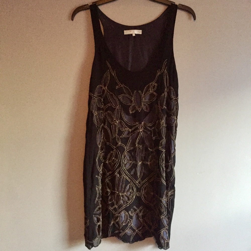Black Cocktail Dress with Gold Cutout Pattern